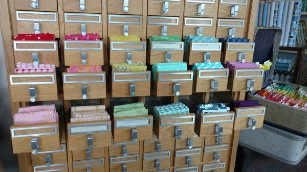 Card catalog filled with a rainbow of fat quarters.