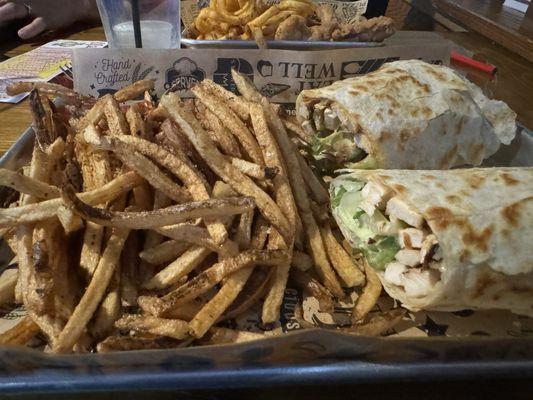 Grilled chicken Caesar wrap. House cut fries.