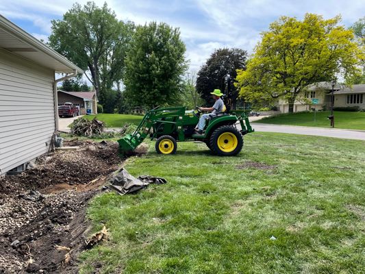 Removing river rock.