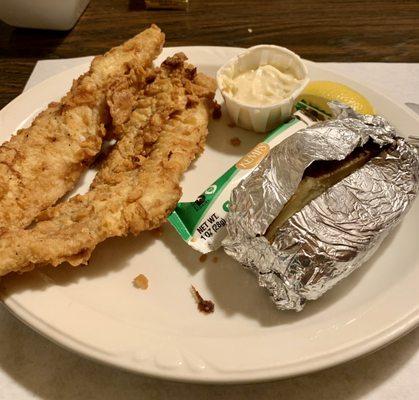 All you can eat fish dinner with baked potato.