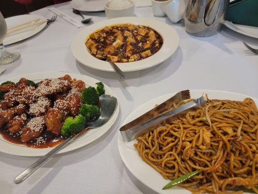 From left, Sesame chicken, maopo tofu and chicken lo mein.