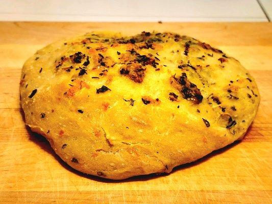 Artisian bread with fresh cilantro, fresh garlic and shredded Asiago cheese