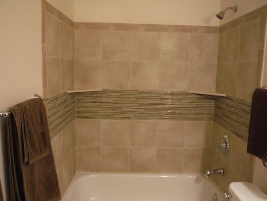 Tub surround and new plumbing with fixtures.