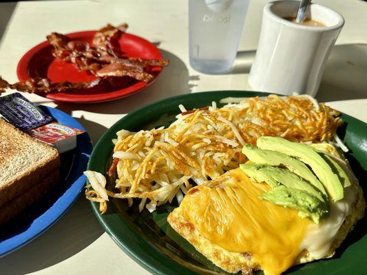 Breakfast menu "build your own omelette". This one had ham, Tillamook cheddar, American cheese, and avocado.