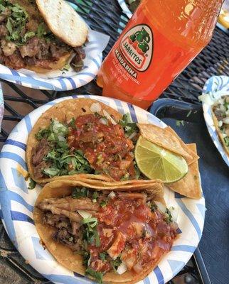 Carnitas tacos with famous mexican soda Jarritos on the side