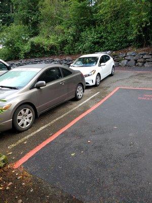 Double parked, blocking fire lane, blocking emergency access road