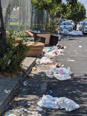 Debris outside recycling center.  This plastic will all end up the storm drains and ocean.