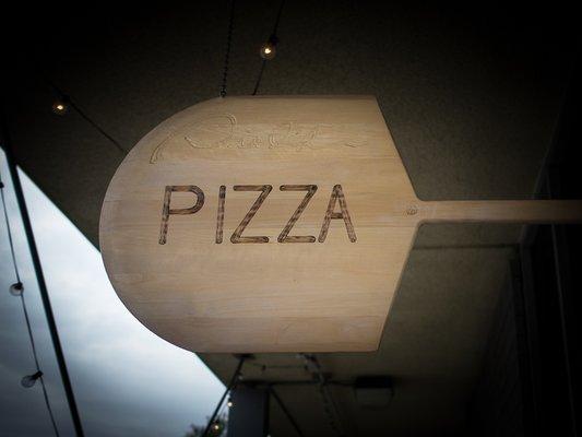 Pizza peel located above the entrance.