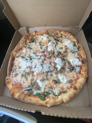 17inch pie with sausage, ricotta, garlic, and spinach.