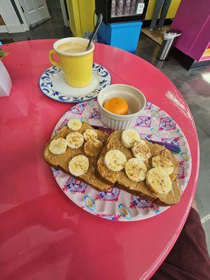 The Sweet: Grain toast with peanut butter spread, banana slices, honey drizzle and cinnamon powder with an orange.   Cafe on leche to drink.