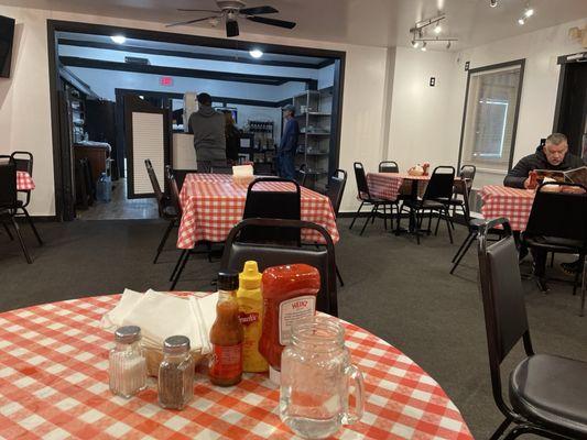 Small dining room with lots of folks in line for take-out.