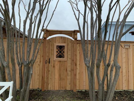 Decorative Gate on a 6 ft fence. Such great craftsmanship.