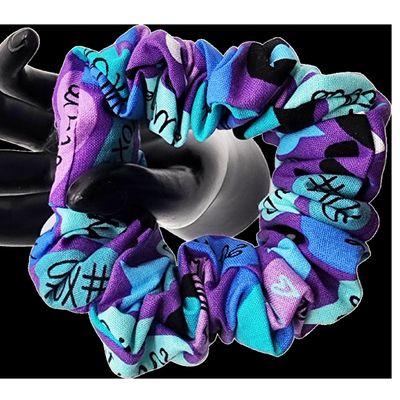 "Elevate your hair game with our 'Heartfelt Healing' Scrunchie. This unique scrunchie blends shades of purple and blue, adorned with charmin