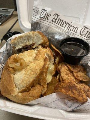 Soft pillowy roll stuffed with tender roast beef, side of tangy us jus and homemade chips