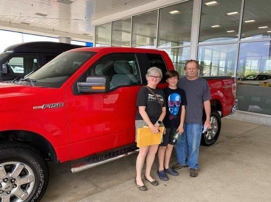 Another happy family drives home with a great value from Champion Chevrolet.