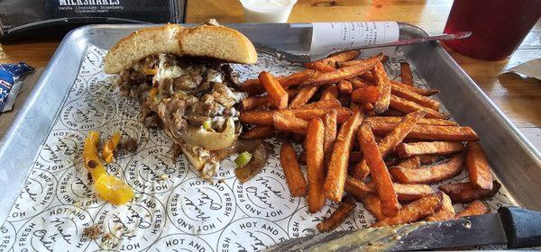 Philly cheese burger and sweet potato fries. Over-stuffed and amazing!