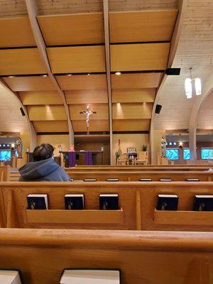 No chairs here. Padded Wooden pews with padded kneelers.  Missal books attached in pew.  Very beautiful wood architecture.   3/19/2022