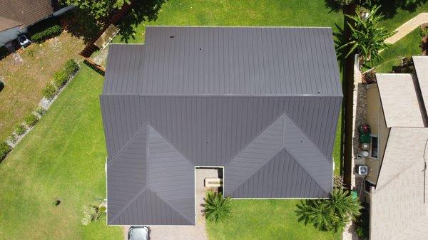 24 Gauge, Galvanized Steel, Standing Seam, with a Dark Bronze finish for the color. Nothing compares to a brand new metal roof in South Fl