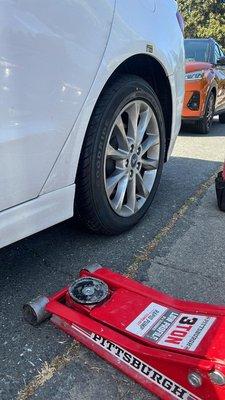 Car jack and New tire