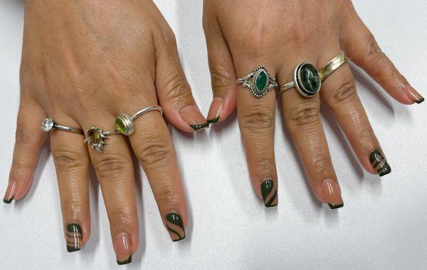 Structured manicure with subtle nail art.