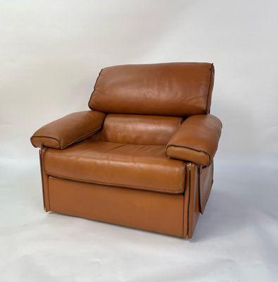 Pictured here is a vintage leather lounge chair that was tastefully restored by our team.