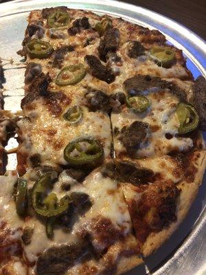 Steak fajita pizza with jalapeños