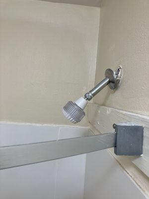 Shower head and shower curtain rod