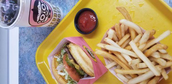 Single cheeseburger with fries and fountain soda.