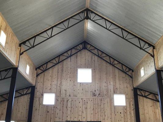 Exposed beams, shiplap walls and steel ceiling