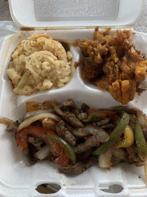 Pepper steak with Mac n cheese and yams