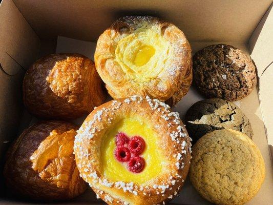 Clockwise: pain au chocolat, cheese danish & lemon curd, salted choco rye, choco chunk, snickerdoodle, fruit brioche, pain au chocolate.