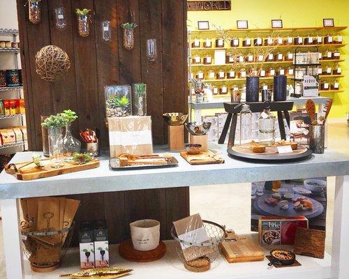 Food tray area with a wall of teas in the back