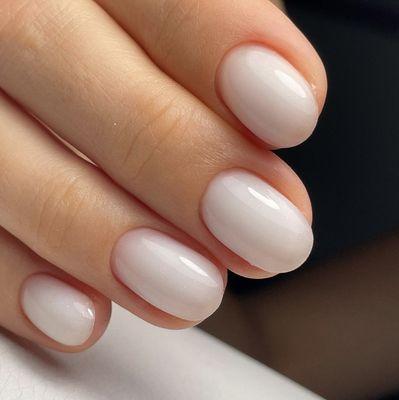 A hard gel overlay on natural nails. Includes: removing the old material, E-file dry manicure, nail shaping, cuticle cutting.