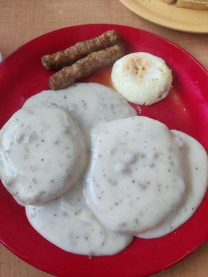 Biscuits and gravy with sausages and poached egg