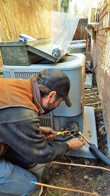 Steve soldering copper lines to the condensor.