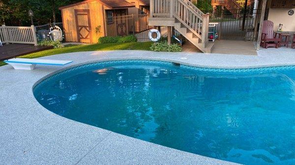 Pool deck coated in premium lifetime warranty polyaspartic flake coating  system