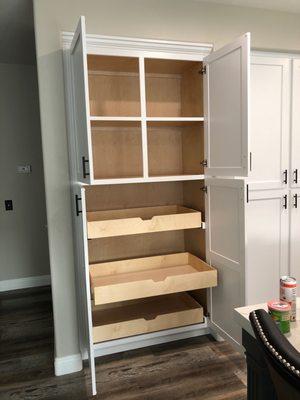 New pantry with pullout shelves and soft close hardware.