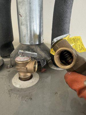 Water heater, pressure relief well replacement