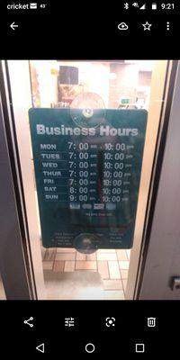 A picture of the store sign saying 10 and the time being 9:20