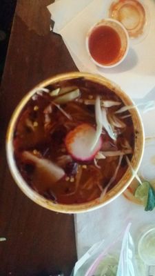 Pozole... Rich  slightly spicy red broth with plenty of pork and hominy...