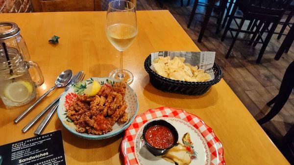 Crispy calamari & crunchy potato chips they put out as an appetizer and the House Oyster Bay Chardonnay which is one of two awesome choices!