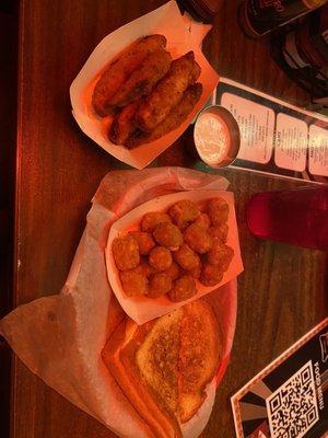 fried pickles, tator tots, and a grilled cheese sandwich