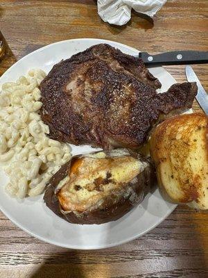 Ribeye, Mac and cheese, baked potato, garlic bread