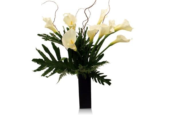 White Callas in a tall contemporary black vase. Classy.