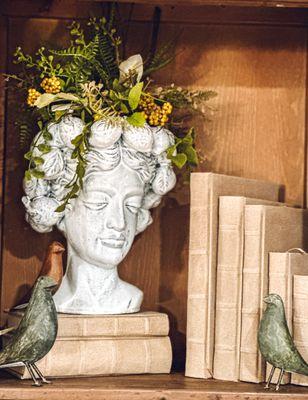 Planter, books, bird statuary