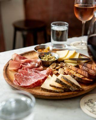 CHEESE & CHARCUTERIE BOARD
A selection of our favorite meats and cheeses, served with orange marmalade,
olive tapenade and marcona almonds