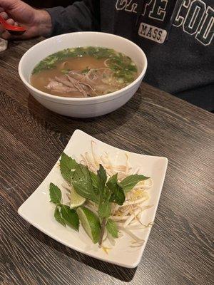 bean sprouts and basil which is supposed to be served with each order of pho.. we were only given this one tiny plate for two people