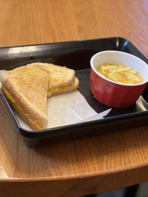 Our grilled cheese and a cup of chicken and noodle soup