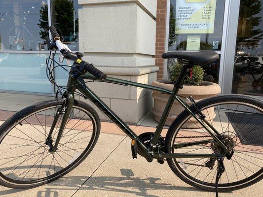 New bicycle with shop front in the background