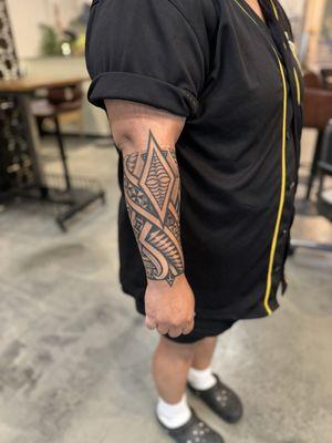 Tongan design tattoo on forearm